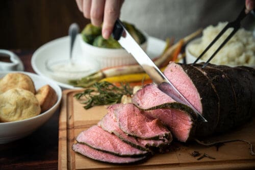 Slicing the perfect roast beef for dinner.